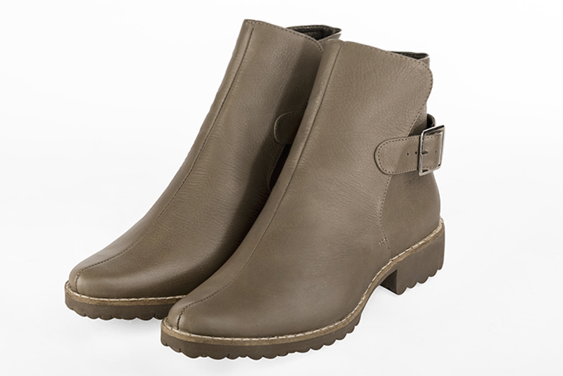Women's taupe brown elegant ankle boots, with buckles at the back. Round toe. Thick rubber soles - Front view